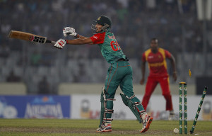 Bangladesh’s Nasir Hossain is bowled out by Zimbabwe’s Tinashe Panyangara during their second Twenty20 international cricket match in Dhaka, Bangladesh, Sunday, Nov. 15, 2015. (AP Photo/A.M. Ahad)
